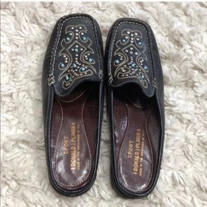 Donald Pliner studded slip on navy leather mules.